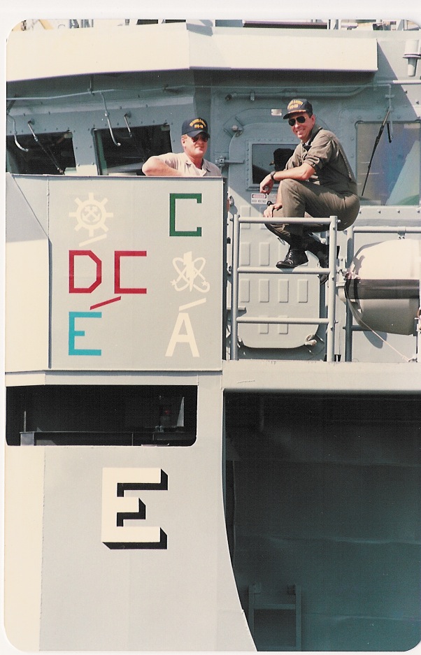Cmdr. Paul X. Rinn, right, the <i>Roberts'</i> commanding officer, and BMCS (SW) George Frost, the crew's senior enlisted sailor, pose on the frigate's port bridge wing above the ship's various Battle Efficiency awards in mid-1988. (Courtesy Paul X. Rinn)