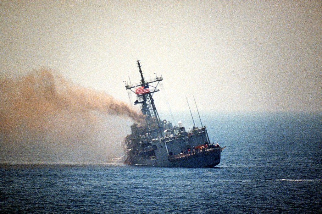 The USS Stark (FFG 31) burns and lists to port on 18 May 1987, one day after the guided missile frigate was struck by two Iraqi-launched Exocet missiles. The attack killed 37 sailors.