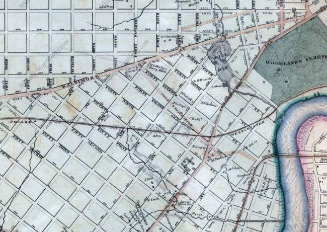 This 1863 map by Samuel Smedley shows actual roads in tan and planned roads outlined in black. Note the headwaters of Perch Creek at the foot of today's S. St. Bernard Street. Further east is the dammed Mill Creek in today's Clark Park. (Via HistoricMapWorks.com)