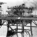 The main building of the Iranian Sassan oil platform burns after being hit by a BGM-71 Tube-launched, Optically-guided, Wire-guided (TOW) missile fired from a Marine AH-1 Cobra helicopter. The attack was part of Operation Praying Mantis which was launched after the guided missile frigate USS SAMUEL B. ROBERTS (FFG-58) struck an Iranian mine on April 14, 1988.