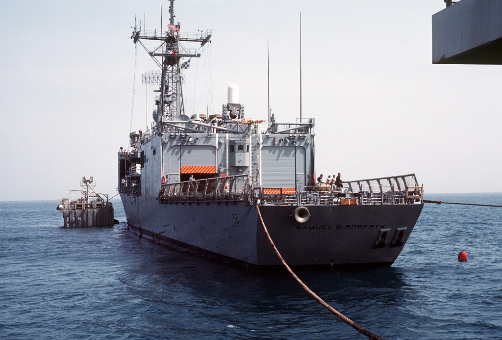 Steel cables are attached to hold <i>Roberts</i> in place above MS2. (PH2 Michael Harnar/U.S. Navy)