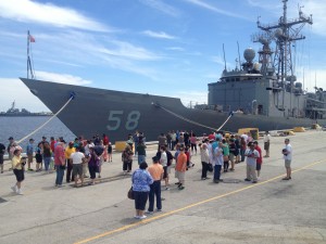 Former Roberts sailors and their families prepare to go aboard during their Mine Blast 25th Anniversary reunion, April 13-14, 2013, in Jacksonville, Fla.