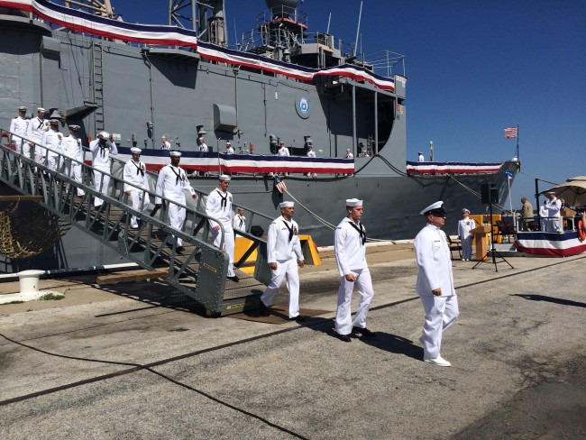 The crew of USS Samuel B. Roberts leaves their ship for the last time on May 22, 2015.